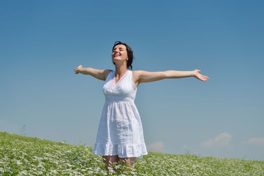Young happy woman in green field photo