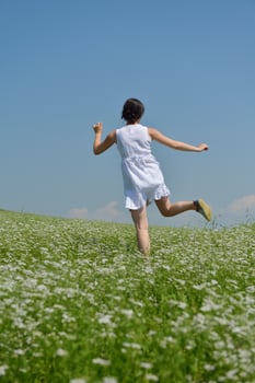Young happy woman in green field photo