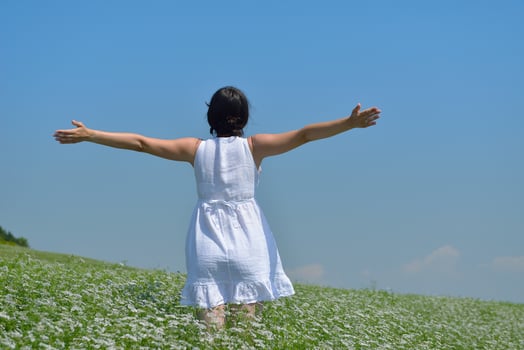Young happy woman in green field photo