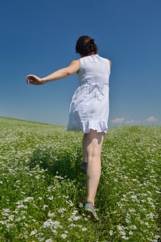 Young happy woman in green field photo