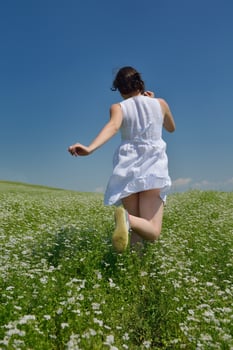 Young happy woman in green field photo