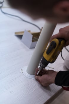 repairman working with drilling machine photo