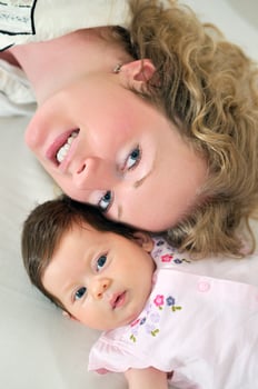 beautiful blonde young mother and cute baby photo