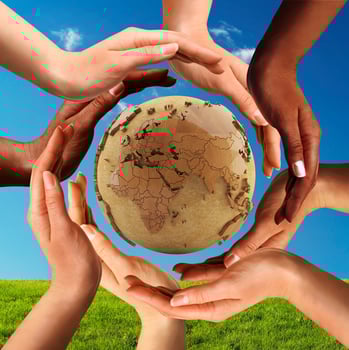 Multiracial Hands Together Around World Globe photo