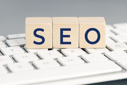 SEO word on wooden blocks on computer keyboard. Search Engine optimization concept photo