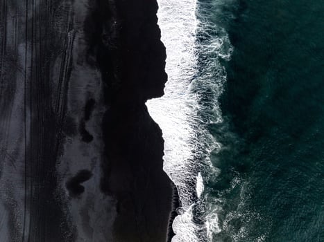 Aerial view of the Iceland coastline by the black beach. photo