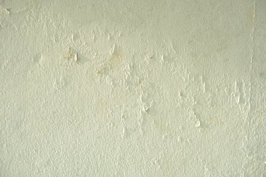 white cement wall background with discolored photo