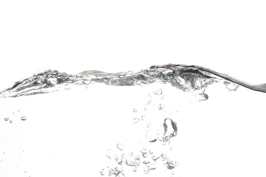 Splashing water surface with a white background photo