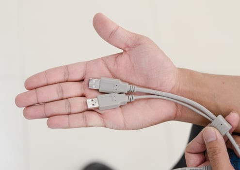 hand holding USB cable hub photo