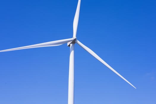 Offshore wind power and energy farm with many wind turbines on the mountain photo