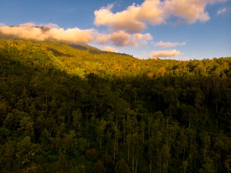 Aerial shot of mountain with clouds photo