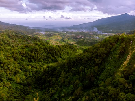Panorama of mountain valley with cloudy sky photo