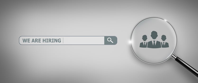 We are Hiring. Job recruitment with Magnifying Glass. photo
