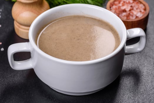 A delicious fresh, thick soup of mushroom puree with breadcrumbs, spices and herbs photo