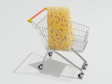 Shopping cart or shopping trolley with big piece of cheese. photo