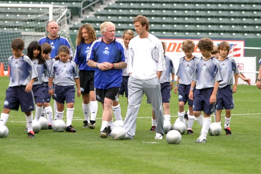David Beckham demonstrates soccer skills for children after press conference to announce Soccer Academy beginning in Fall 2005 at the Home Depot Center in So California. Carson, CA June 2, 2005 photo
