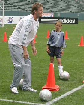 David Beckham demonstrates soccer skills for children after press conference to announce Soccer Academy beginning in Fall 2005 at the Home Depot Center in So California. Carson, CA June 2, 2005 photo
