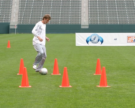 David Beckham demonstrates soccer skills for children after press conference to announce Soccer Academy beginning in Fall 2005 at the Home Depot Center in So California. Carson, CA June 2, 2005 photo