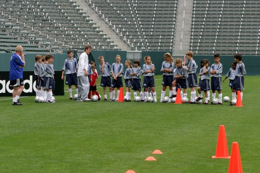 David Beckham demonstrates soccer skills for children after press conference to announce Soccer Academy beginning in Fall 2005 at the Home Depot Center in So California. Carson, CA June 2, 2005 photo
