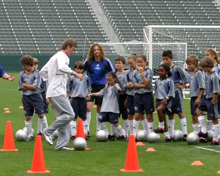 David Beckham demonstrates soccer skills for children after press conference to announce Soccer Academy beginning in Fall 2005 at the Home Depot Center in So California. Carson, CA June 2, 2005 photo