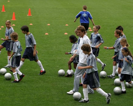 David Beckham demonstrates soccer skills for children after press conference to announce Soccer Academy beginning in Fall 2005 at the Home Depot Center in So California. Carson, CA June 2, 2005 photo