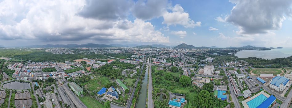 Phuket Thailand on March 28-2022 Aerial view drone photography High angle view of Phuket city, Phuket province Thailand. Panorama of phuket city thailand in sunny day sky background photo