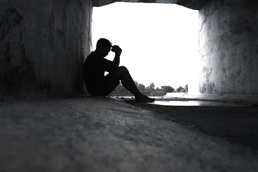 Asia you man sitting alone.He sitting in  under big tunnel.man very sad and depressed.sad,alone,suicide.despair. sickness.photo health and disappointment concept. photo