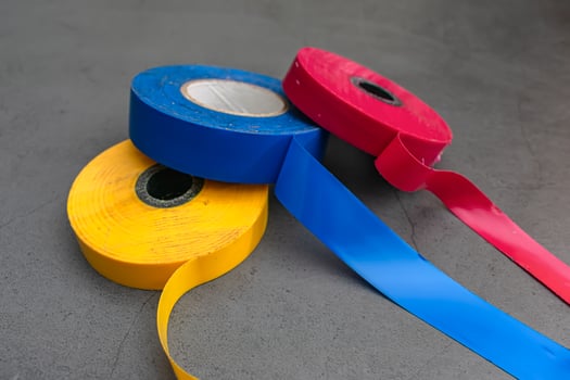 Three pieces of insulating adhesive tape in three colors photo