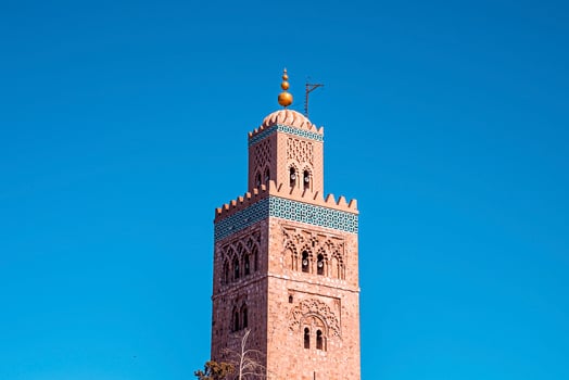 Koutoubia Mosque minaret an old historic arab tourist landmark in oriental Marrakech photo