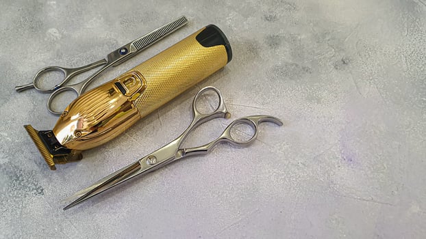 Special hairdressing clippers, nozzles and scissors. Professional equipment. photo