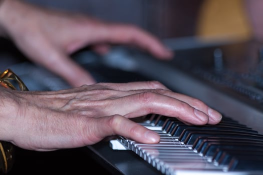 Man playing a keyboard in a pub in Barnes london on January 29, 2010. Unidentified man. photo