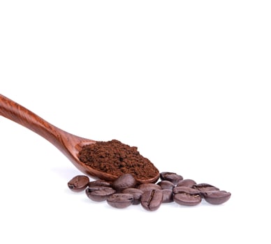 Coffee beans with ground coffee in a spoon on a white background photo