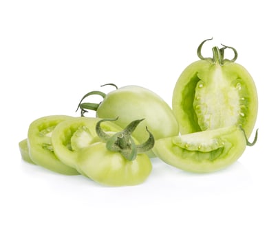 Whole fresh green tomatoes and sliced isolated on white background photo