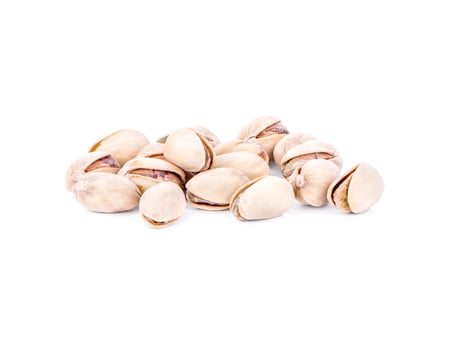 toasted pistachios on a white background photo