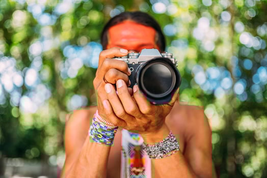 Pataxo Indian from southern Bahia holding a camera photo