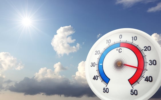 Thermometer with celsius scale showing extreme high temperature. photo