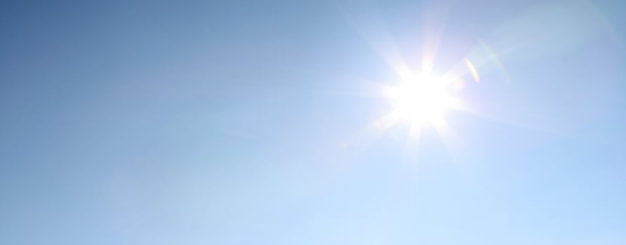 Blue sky during a sunny day with sunlight. photo