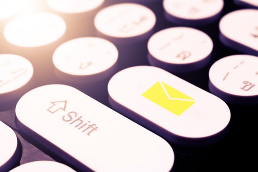 mail symbol on white keyboard photo