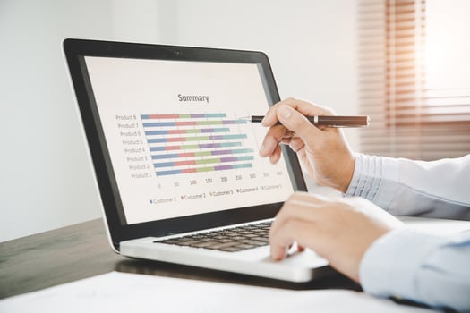 Business woman use on-line via laptop computer photo