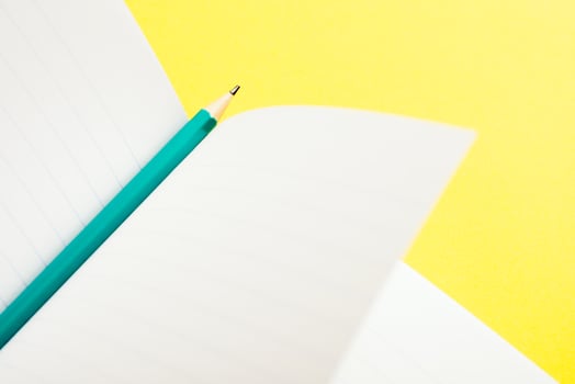 Simple education and business concept still life. A pencil on an open notebook. photo