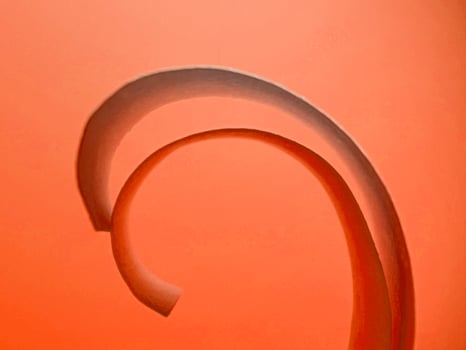 vibrant colourful red paper spiral ribbon high quality image or photograph photo