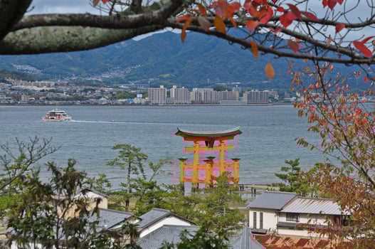 Historical red sacred Miyajima gate in Hiroshima Japan photo
