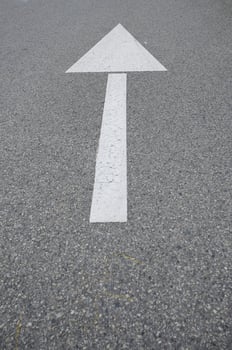 white arrow on the road photo