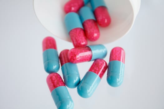 colorful pills on white background photo