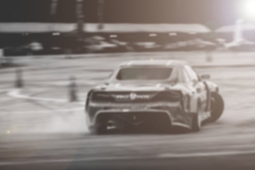 Lens blur of car racing. car race background concept photo