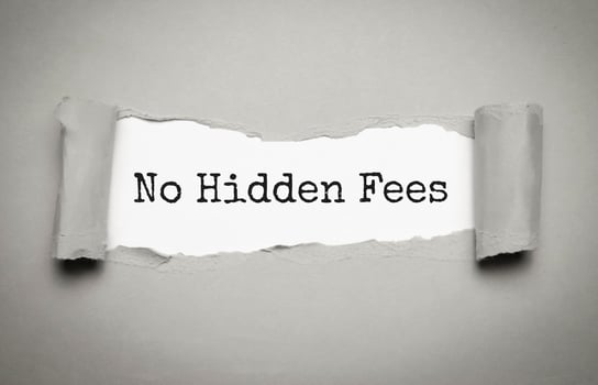The text NO HIDDEN FEES appearing behind torn grey paper photo