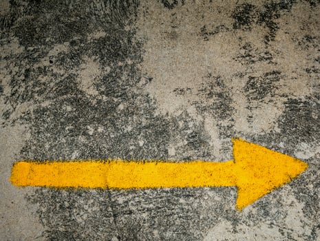 traffic direction arrow on the road photo