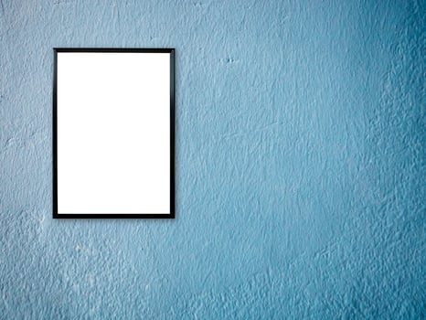 poster frame on blue paint wall background photo