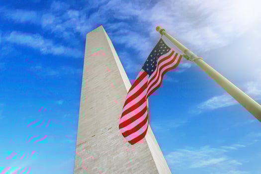 Washington monument with the USA flag on a sunny day. Washington D.C. USA. photo