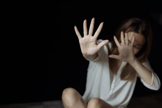 Girl hand is stopping harassment on the bedroom. stop violence against Women, international women's day. photo